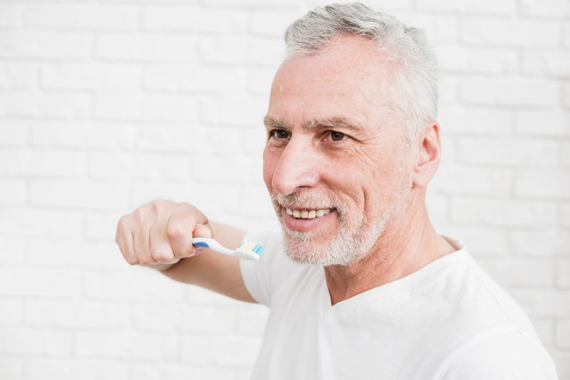 elder-man-washing-his-teeth
